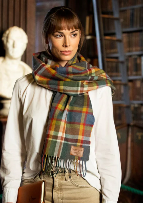 A woman wearing a patterned scarf.